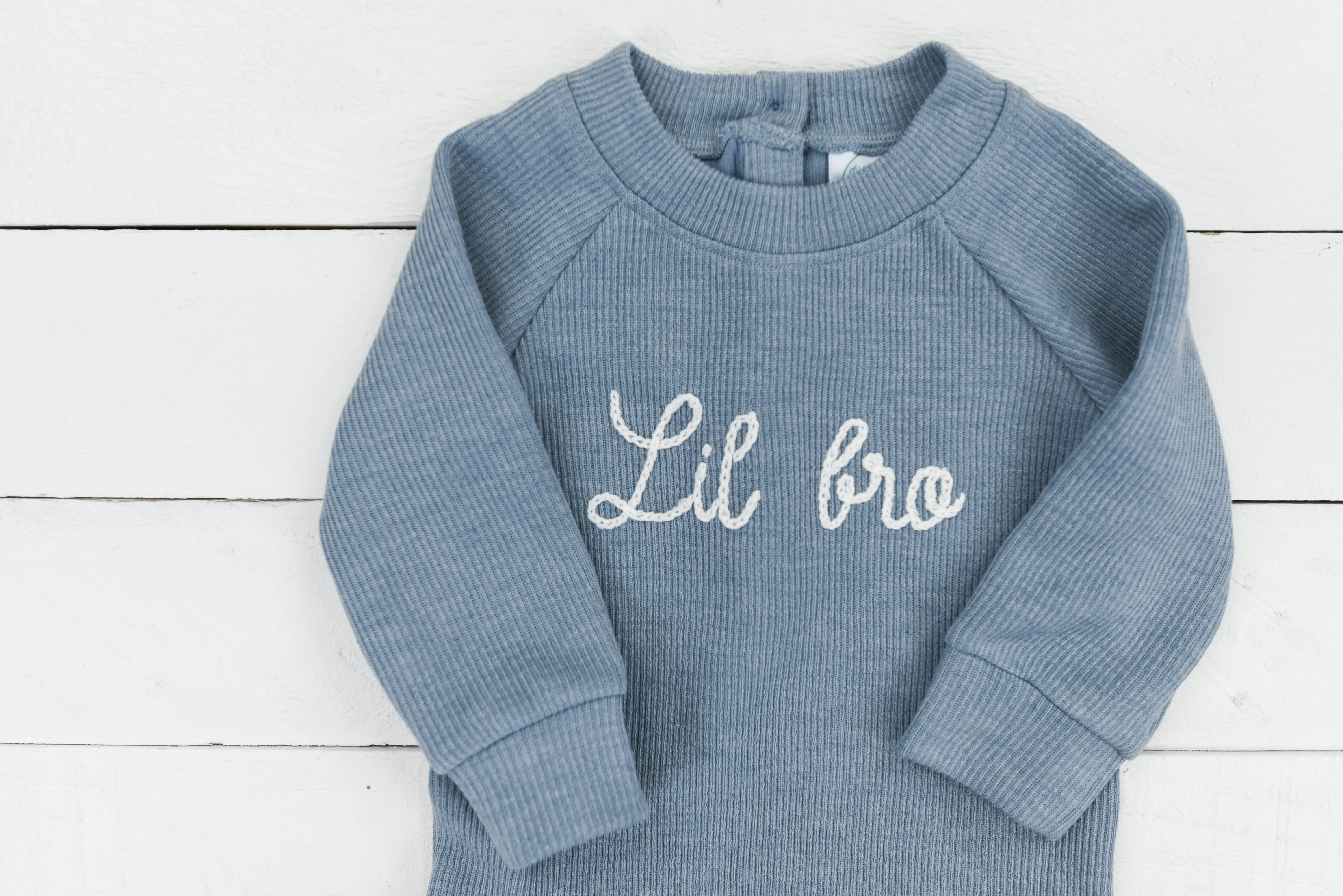 Chainstitch blue sweater onesie